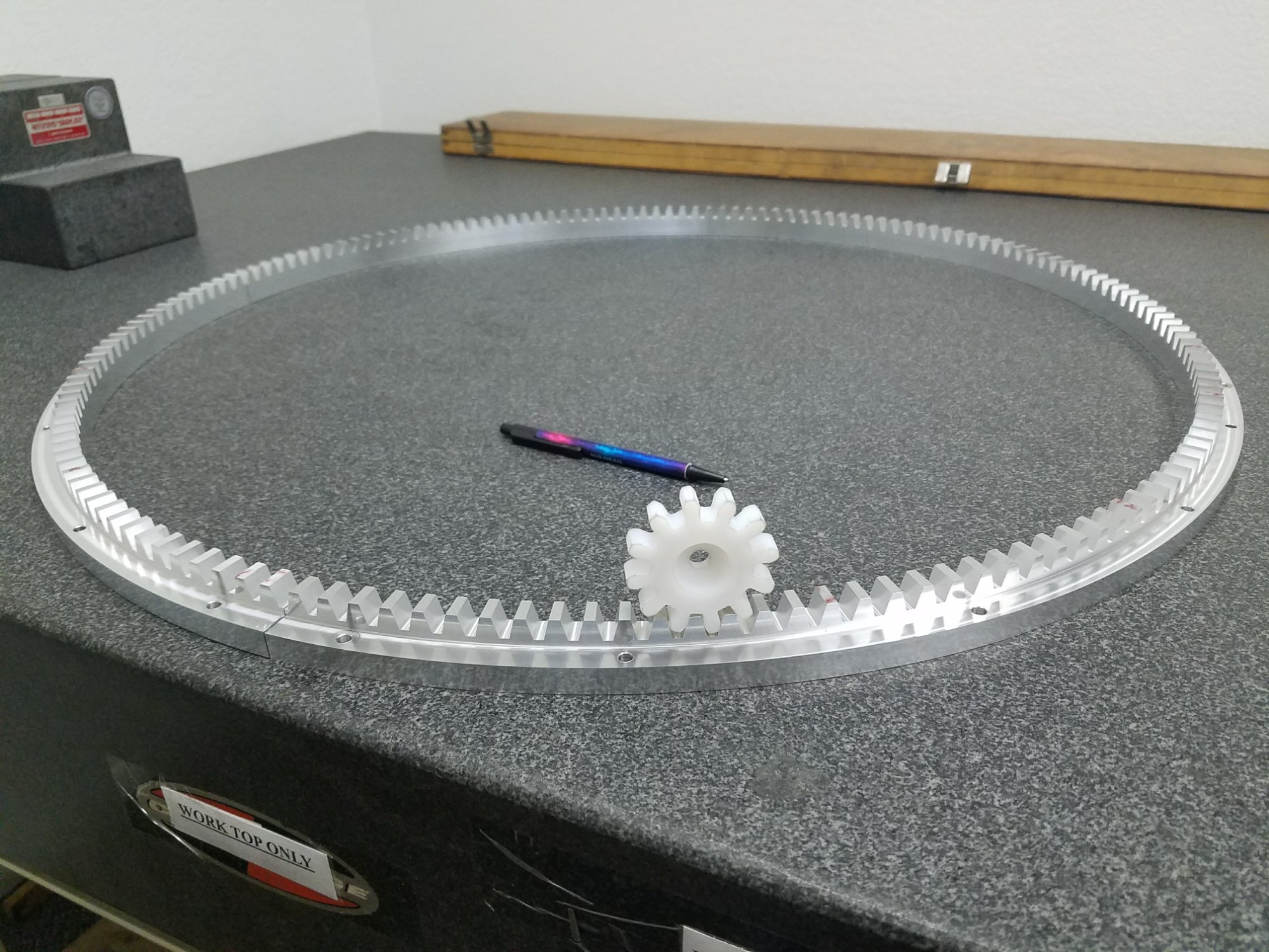 Large diameter machined aluminum ring gear with machined plastic pinion — precision machining in multiple materials